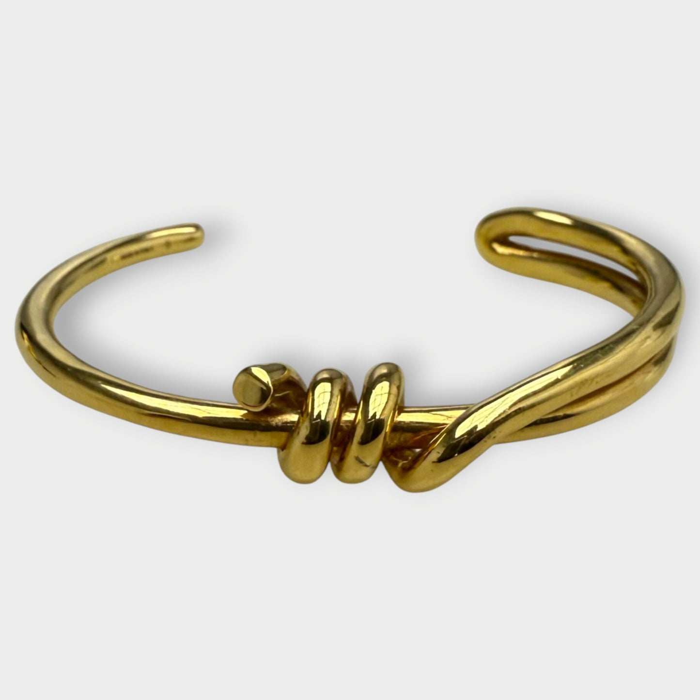 Gold Toned Metal Knot Cuff Bracelet